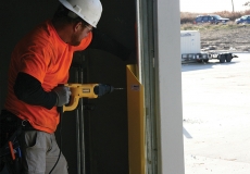 installation-technician-working-on-vertical-lift-loading-dock-equipment