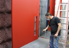 paint-technician-customizes-door-colors-before-hardware-is-installed
