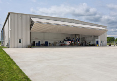 bi-folding-overhead-door-for-helicopter-hangar